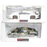 A UT Models 1/18 scale boxed Porsche 911 GT1 race car group to include No. 39627 GT1 1996 test