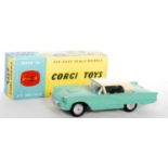 A Corgi Toys No. 214 Ford Thunderbird saloon comprising of pale green body with cream hood and