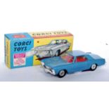 A Corgi Toys No. 245 Buick Riviera, comprising of metallic blue body with red interior and cast