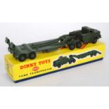 A Dinky Toys No. 660 military tank transporter comprising of military green body and matching