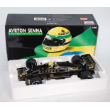 A Minichamps Model No. 540861812 1/18 scale model of a Lotus Renault 98T 1986 F1 race car, appears