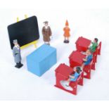 A Crescent Toys Schooldays figure group, to include headteacher and desk, dunce figure, chalkboard