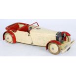 An original Meccano No. 1 Constructors Car comprising of cream and red body with cream hubs and