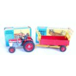 A Corgi Toys boxed tractor and farm implement diecast group to include a Corgi Toys No. 66 Massey