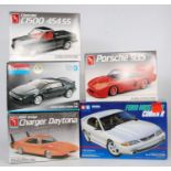 A Tamiya, Monogram, and AMT 1/24 and 1/25 scale Classic Car and 4x4 plastic kit group, five