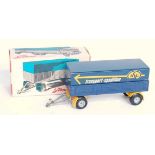 A Tekno No. 452 single draw-bar trailer comprising of dark blue and yellow body with cast hubs and