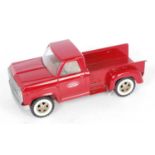 A Tonka Toys heavy pressed steel model of a Chevrolet style pick-up truck, finished in red with