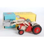 A Corgi Toys No. 53 Massey Ferguson 65 tractor with shovel comprising of red and cream body with red
