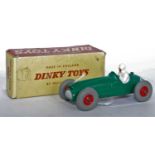 A Dinky Toys No. 233 Cooper Bristol racing car, comprising of green body with red plastic hubs,