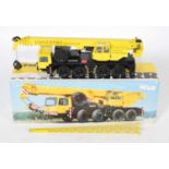 A Conrad No.2079 1:50 scale model of a Coventry Crane Hire Liebherr LTM 1060 mobile crane,