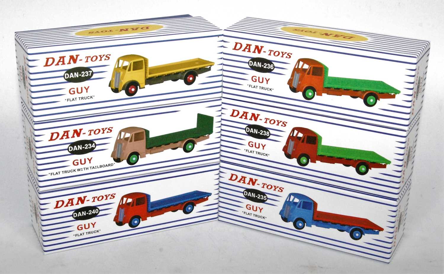 Six various boxed as issued Dan-Toys guy flat trucks and flat trucks with tail boards, various