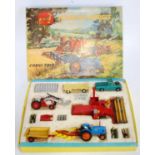 A Corgi Toys gift set No. 22 farming models to include various farm vehicles and accessories,