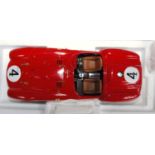 A BBR Models 1/18 scale model of a Ferrari 375+ finished in red with racing No. 4, as seen in the