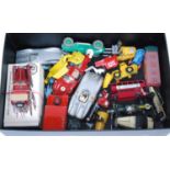 A collection of various loose and boxed diecast white metal and tinplate vehicles and accessories,