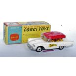 A Corgi Toys No. 430 Bermuda Taxi comprising of white body with yellow interior and unusual all-