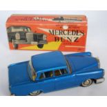 An M Toys of Japan tinplate and battery operated model of a Mercedes Benz 220S comprising metallic