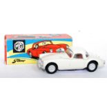 A Tekno No.824 MGA 1600 saloon comprising of off-white/cream body with red interior and silver hubs,