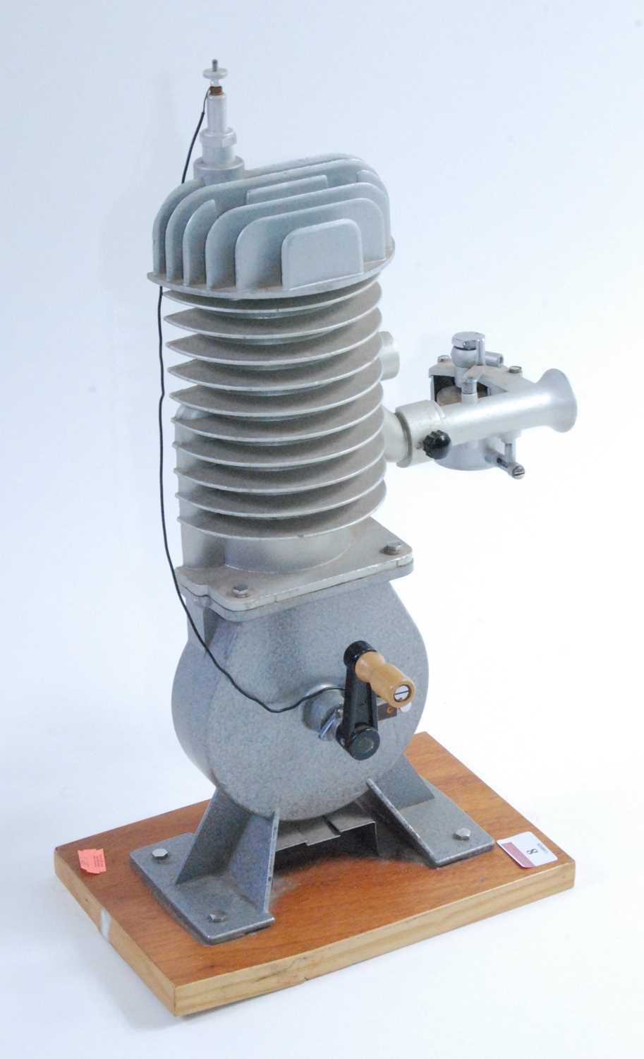 An Irwin & Partners Ltd of Croydon cast cut-away demonstration model of a two-stroke engine, hand- - Image 2 of 2