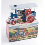 A Wilesco D40 Old Smoky traction engine, comprising of blue, silver and red body, free running