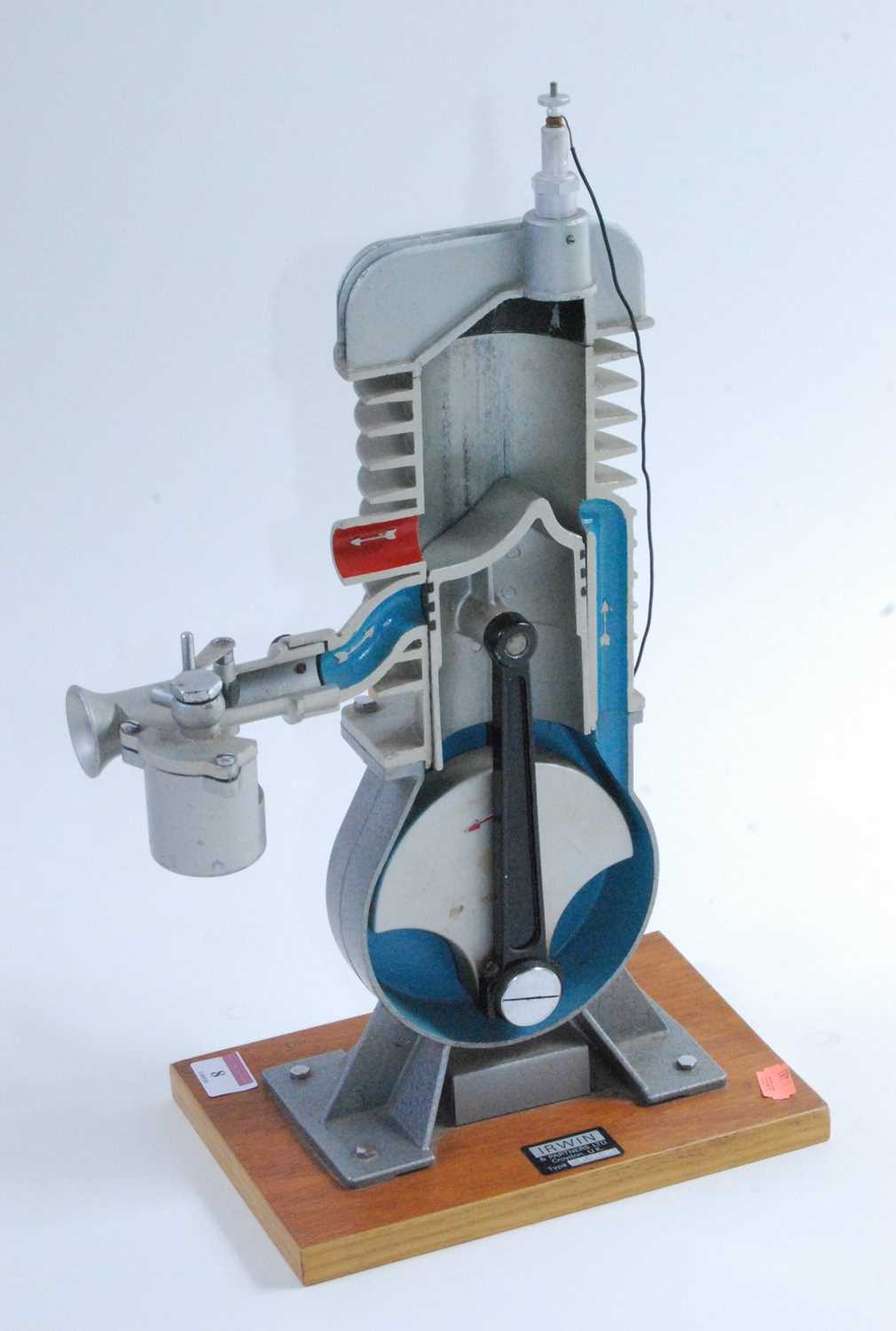 An Irwin & Partners Ltd of Croydon cast cut-away demonstration model of a two-stroke engine, hand-