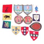 A collection of WW II and later British Army formation signs to include