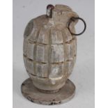 A deactivated Mills No.36 grenade