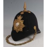 A 20th century Royal Anglian blue cloth covered helmet,