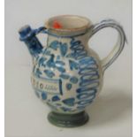 A 17th century Italian maijolica wet drug jar, blue & white decorated with leaves, and titled SYO