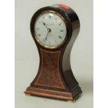 A modern mahogany and boxwood strung cased balloon shaped mantel clock, having a convex enamelled