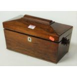 A Victorian rosewood tea caddy, of sarcophagus form, the hinged lid opening to reveal a central