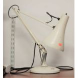 A cream painted anglepoise desk lamp