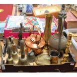 A box of miscellaneous metalware, to include a pair of turned brass candlesticks, brass hand