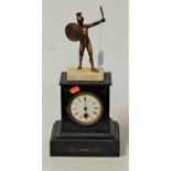 A late 19th century black slate cased mantel clock, having enamelled dial with Roman numerals and