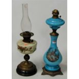 A Victorian blue opalescent glass oil lamp, having glass font and bulbous body, transfer printed