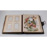 A Victorian tooled leather bound photograph album