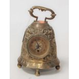 A brass cased bell shaped mantel clock having a circular dial with Arabic numerals, height 23cm