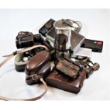 A box of miscellaneous items to include a pair of WWI binoculars with War Department mark, a