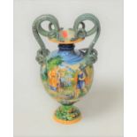 A large 19th century Italian majolica glazed vase, of baluster form, having twin handles,