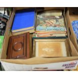 A box of miscellaneous items to include early 20th century leather bound photograph album, Puffin