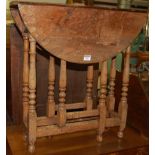 A small oak drop flap gateleg occasional table on turned and square cut supports, width 61cm