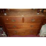 An Edwardian walnut chest of two short over two long drawers, width 106cm