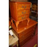 A contemporary cherry wood round cornered chest, of three short and four long drawers, w.87cm;