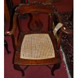 An unusual 19th century mahogany and cane seat elbow chair, having pierced splatback, width 65cm;