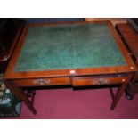 A 19th century mahogany and gilt tooled green leather inset drop-flap two drawer writing table,