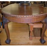 A circa 1900 mahogany D-end extending dining table, having a wind-out action, single extra drop-in