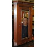 An Edwardian walnut single mirrored door hanging corner cabinet, height 71cm