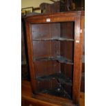 A 19th century provincial oak open hanging corner cupboard