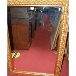 A contemporary floral gilt framed rectangular wall mirror, 107 x 76cm