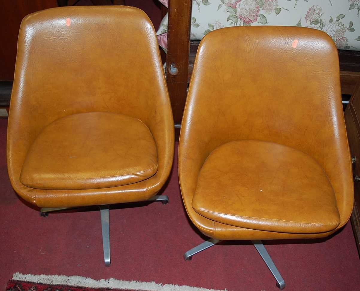 A set of four 1960s tan vinyl upholstered swivel chairs raised on chrome basesCondition report: