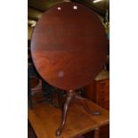 A 19th century mahogany circular tilt-top pedestal tripod table, with birdcage undertier, dia. 83cm